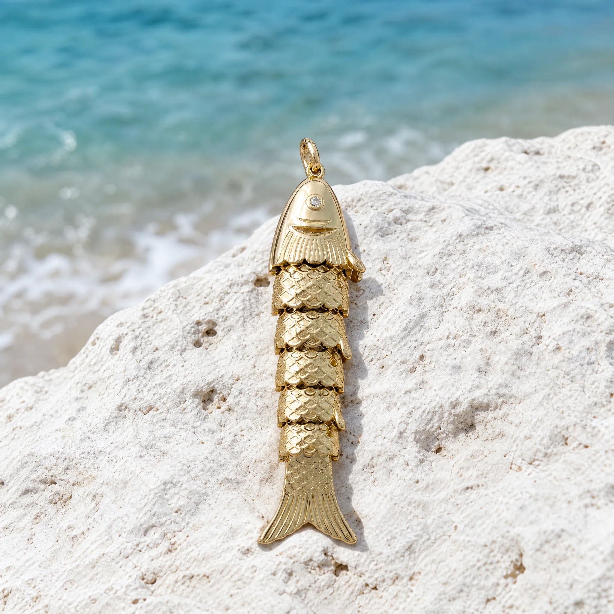 CALEO ocean lifestyle image - Gold Articulated Ocean Fish Pendant Charm - ocean-ref19-gold-articulated-ocean-fish-pendant-charm - 2026-07-23