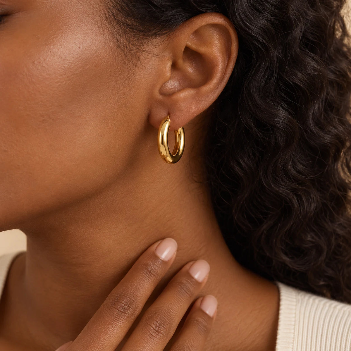 Polished Curve Hoops - lifestyle gold hand