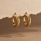 Polished Curve Hoops - still life gold paper