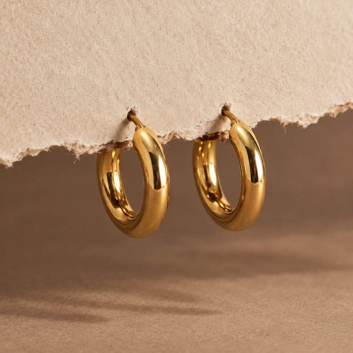 Polished Curve Hoops - still life gold paper