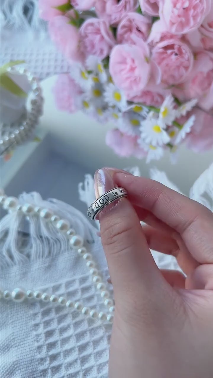 She Will Not Fall Ring shown in a soft floral close-up