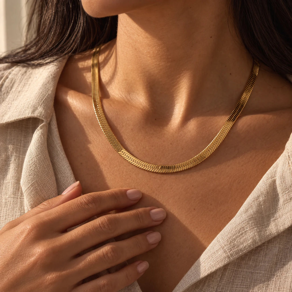 Radiant Herringbone Choker - lifestyle gold hand beige linen