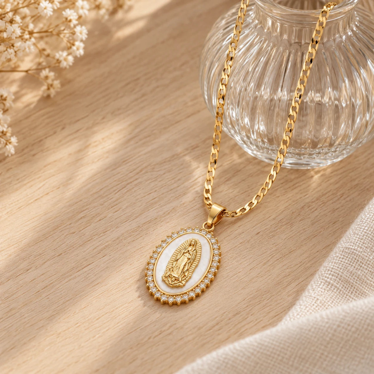 Radiant Mary Medallion Necklace - flatlay glass vase