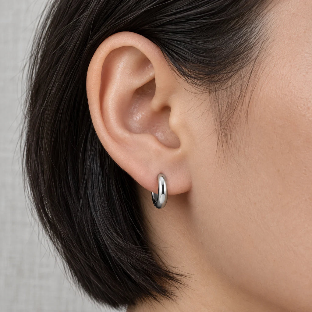 Sculpted Dome Huggie Hoops - lifestyle silver ear