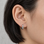 Sculpted Dome Huggie Hoops - lifestyle silver ear