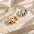 Sculpted Dome Huggie Hoops - lifestyle gold silver flatlay