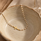 Serene Pearl Cross Necklace - still life gold ceramic