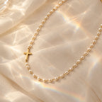 Serene Pearl Cross Necklace - still life gold prism