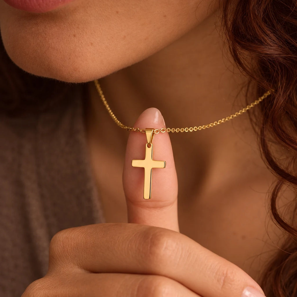 Steadfast Cross Necklace - steadfast cross gold finger detail