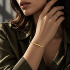Gold This Too Shall Pass Letter Bracelet styled with an olive satin look