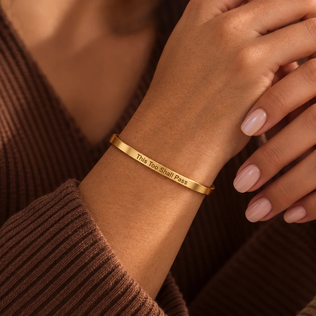 Gold This Too Shall Pass Slim Cuff with outside engraving worn on the wrist