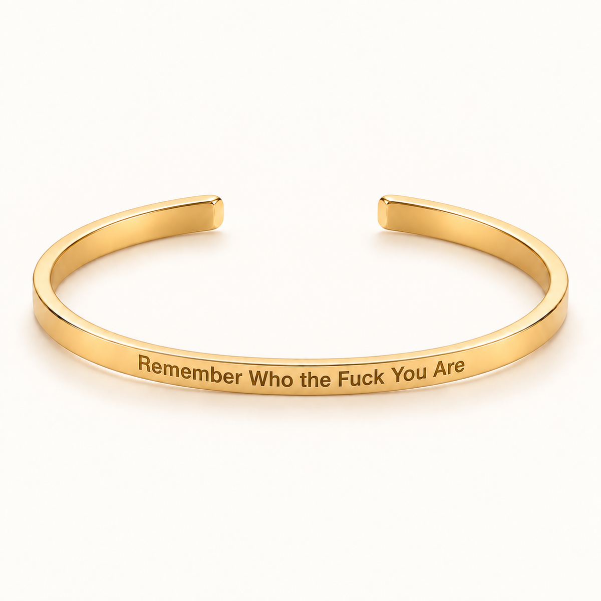 Gold open Slim Cuff with Remember Who the Fuck You Are engraved on the outside