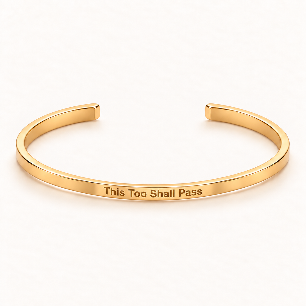 Gold open Slim Cuff with This Too Shall Pass engraved on the outside