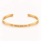 Gold open Slim Cuff with This Too Shall Pass engraved on the outside