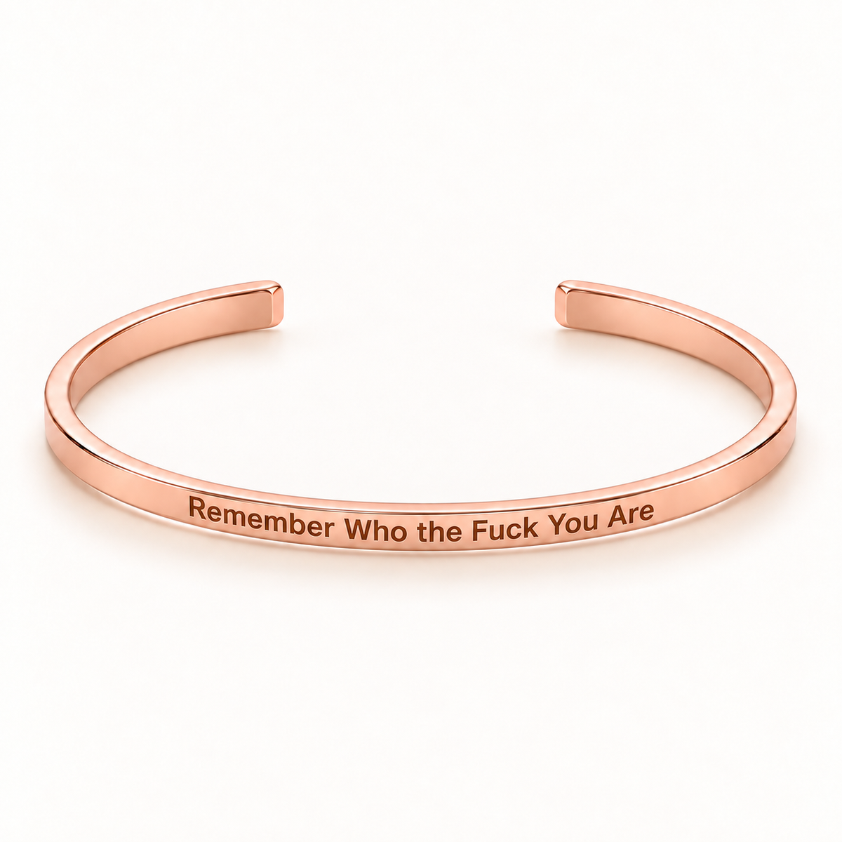 Rose Gold open Slim Cuff with Remember Who the Fuck You Are engraved on the outside
