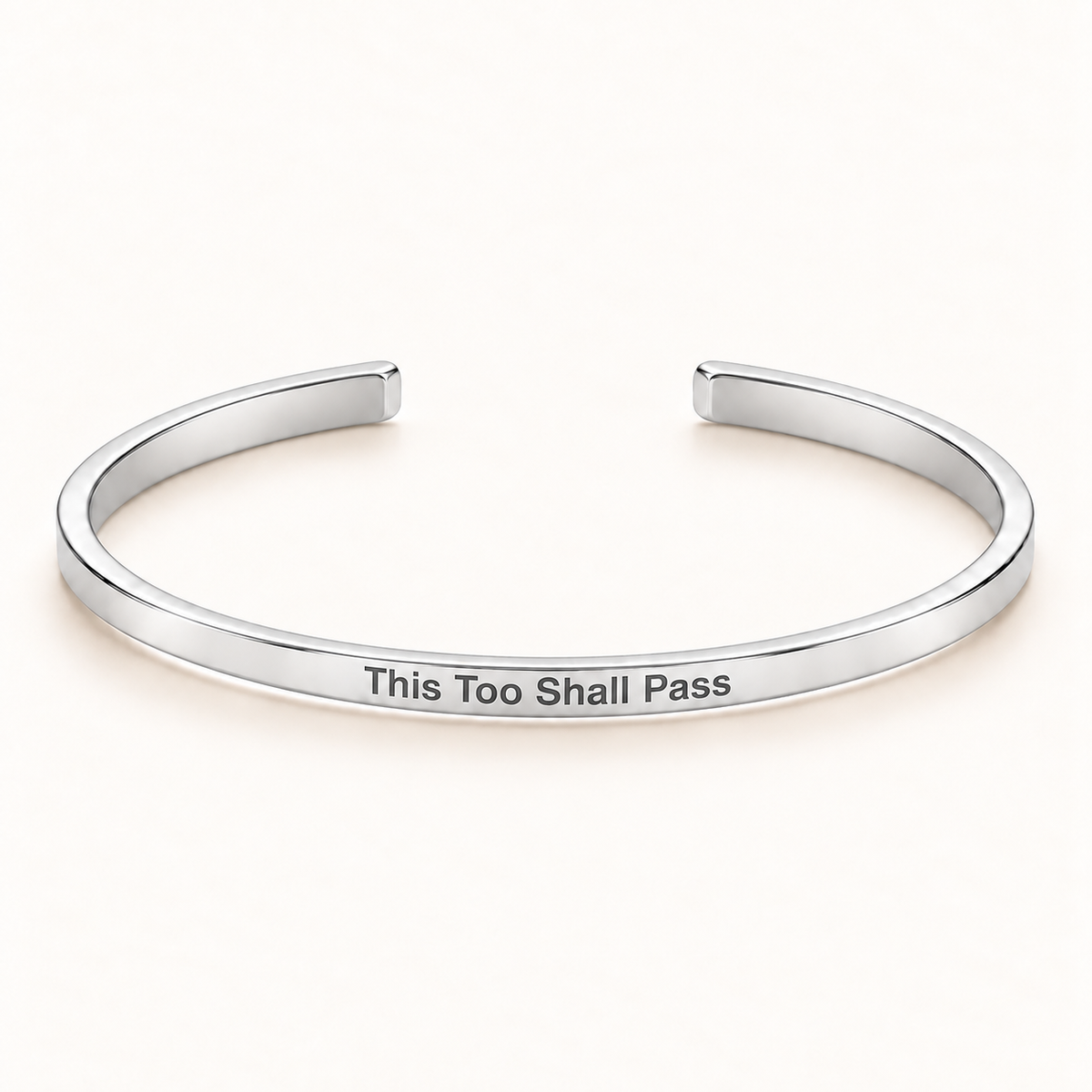Silver open Slim Cuff with This Too Shall Pass engraved on the outside