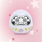 CALEO Japanese charm thumbnail - White Daruma Doll Charm - pink star background - 2026-07-22